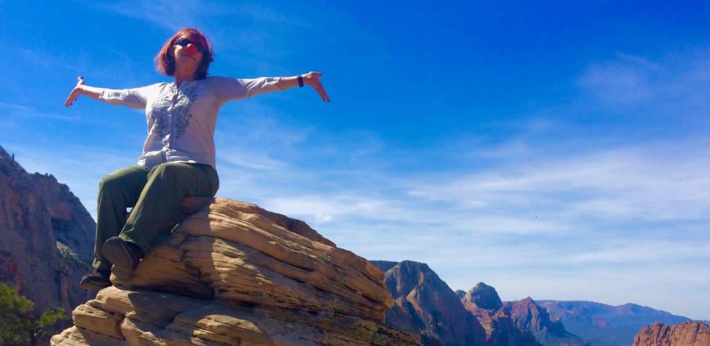 Eva Moon atop Angel's Landing in Zion National Park, Utah, wearing a clown nose